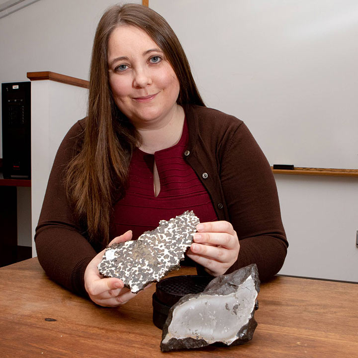 Photo of Prof. Irving holding a rock