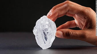 Hand holding large diamond